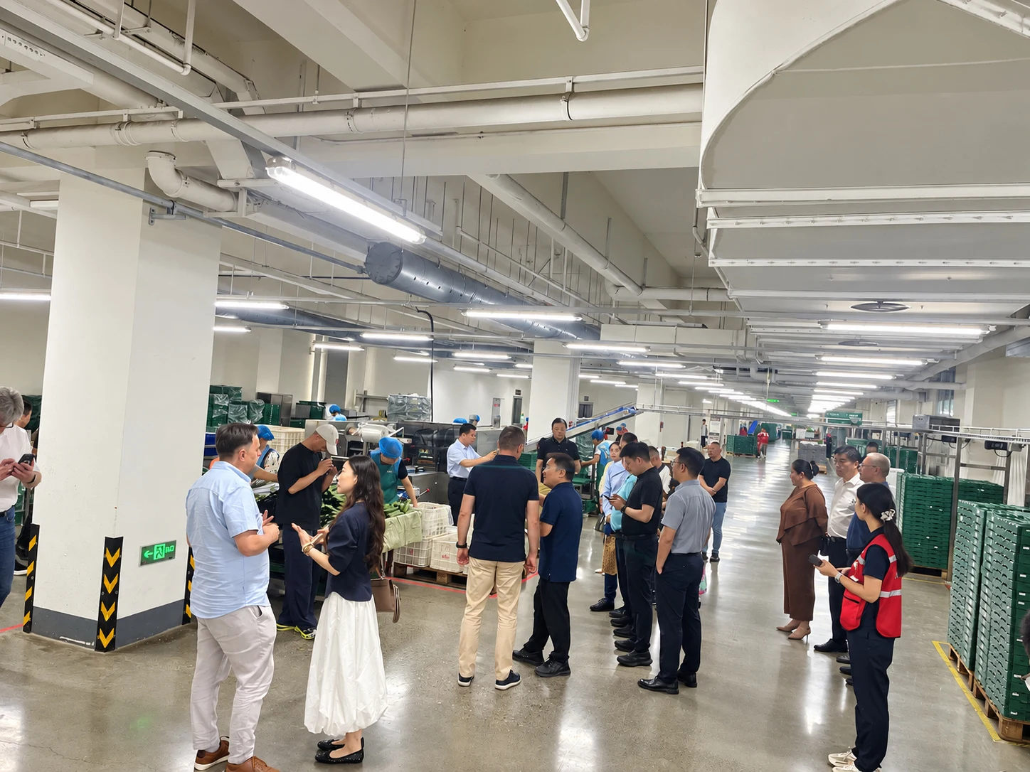 Customers touring a processing facility