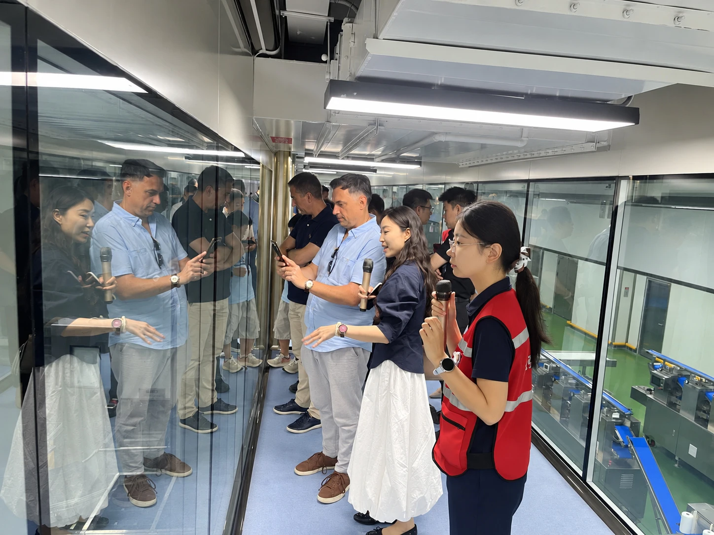 Customers visiting a production line with on-site staff